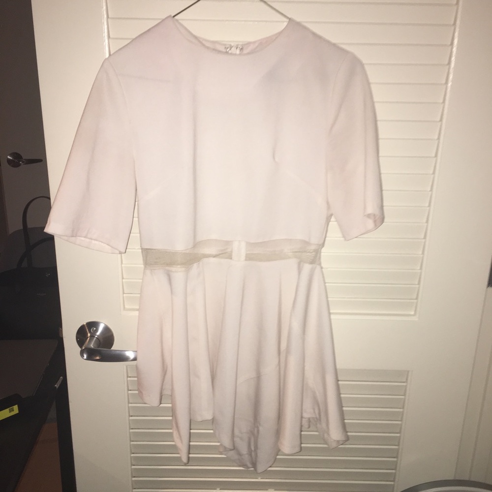 Asymmetrical mesh peplum top